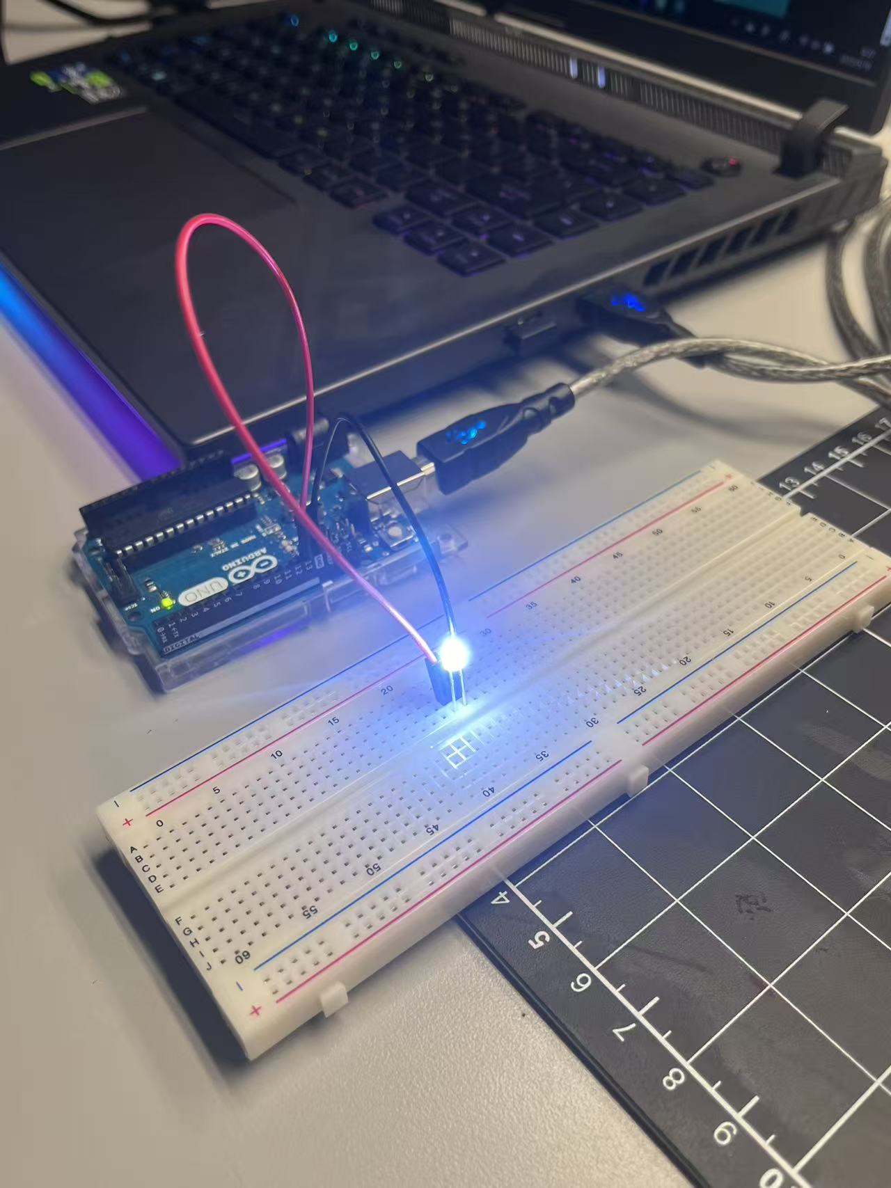 The LED circuit is powered through the Arduino board connected to a laptop via USB, allowing quick testing and live power supply.